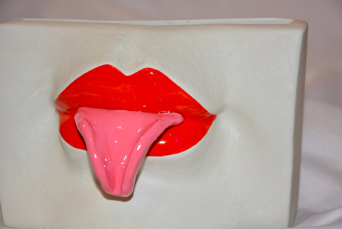 CERAMIC TONGUE OUT VASE