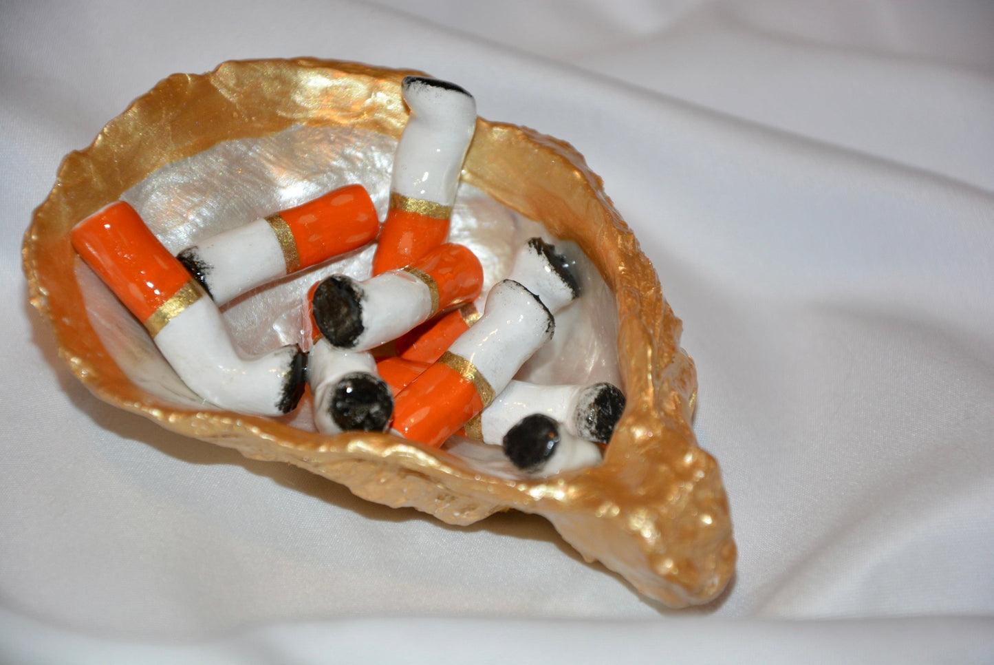 OYSTER SHELL CIGARETTE SCULPTURE