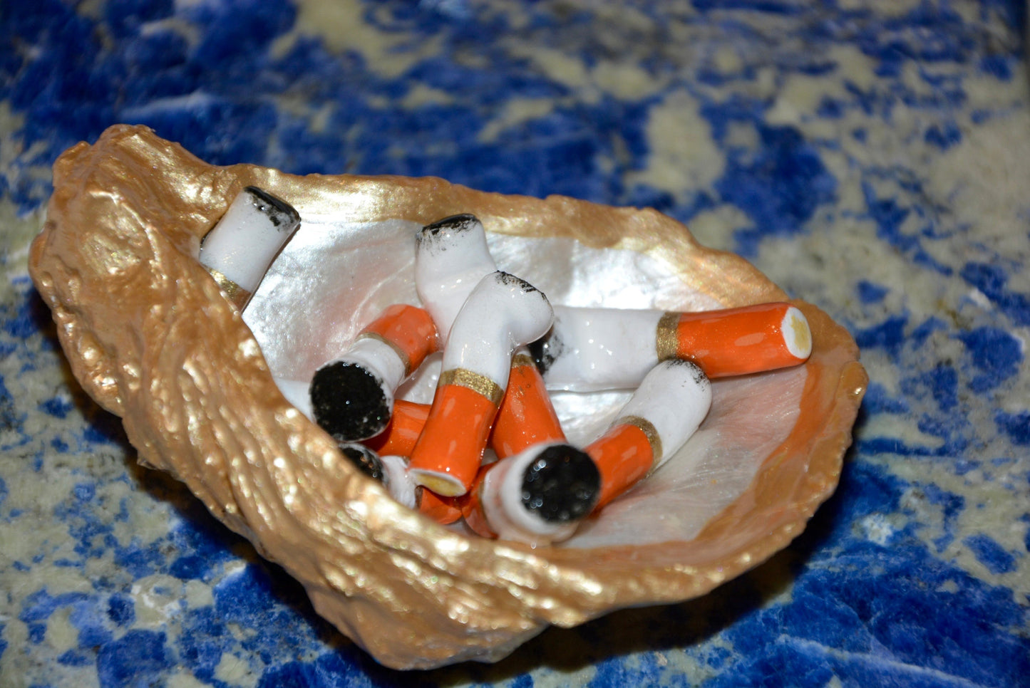 OYSTER SHELL CIGARETTE SCULPTURE