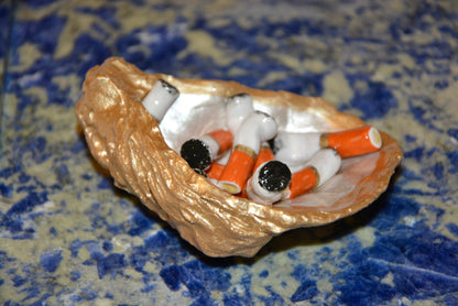 OYSTER SHELL CIGARETTE SCULPTURE